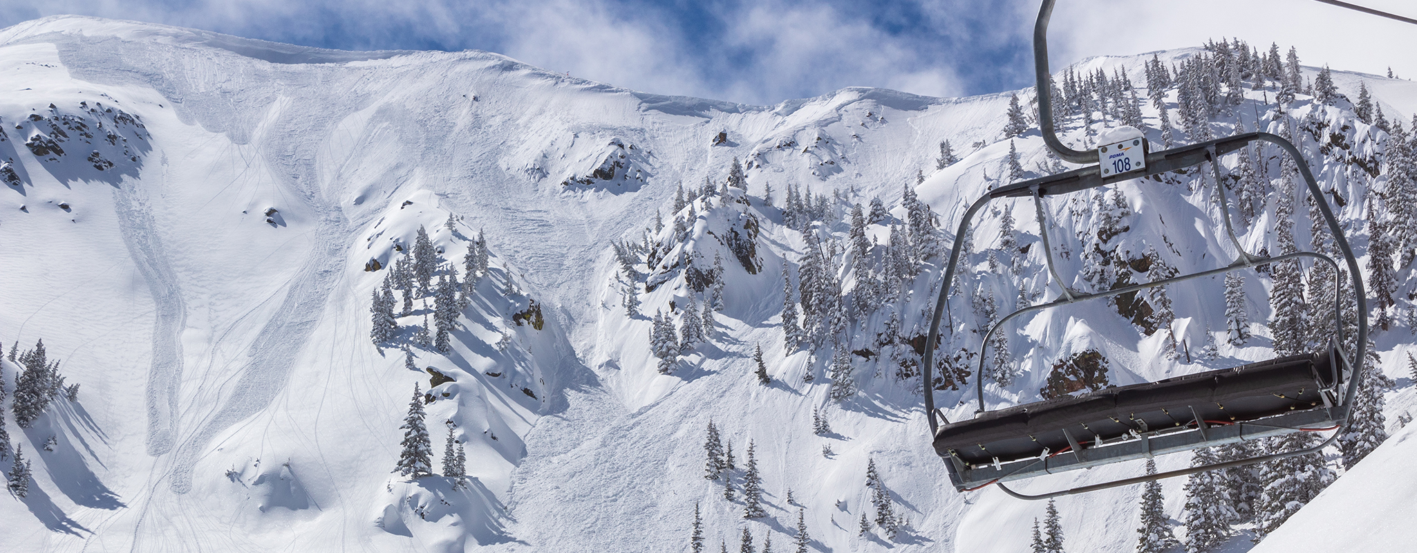 A chairlift passes in front of Kachina Peak in Taos Ski Valley.