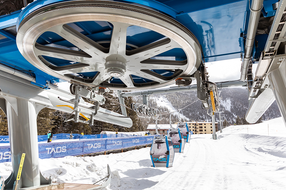 The large wheel of a ski gondola.