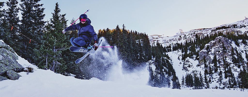 Skier doing an iron cross at Taos Ski Valley