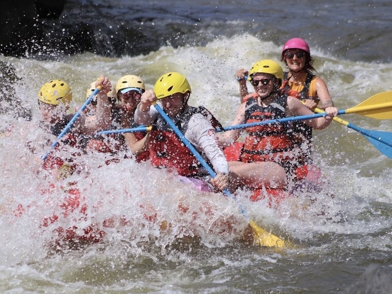 People whitewater rafting