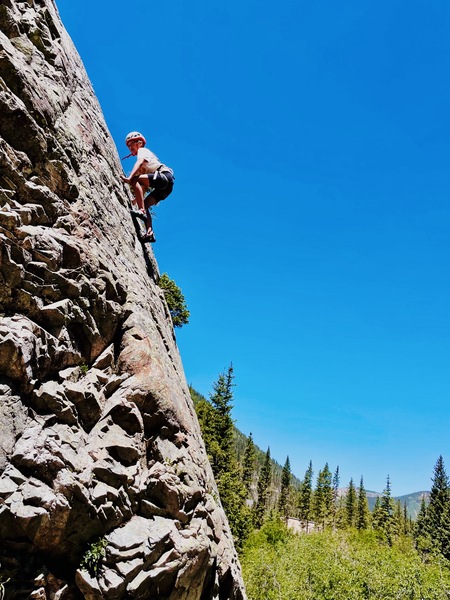 Person climbing a rock