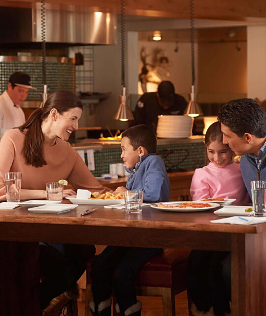 A family eats a meal together at the 192 restaurant