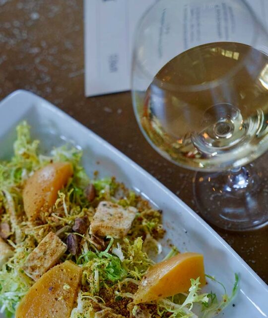 Salad and glass of white wine