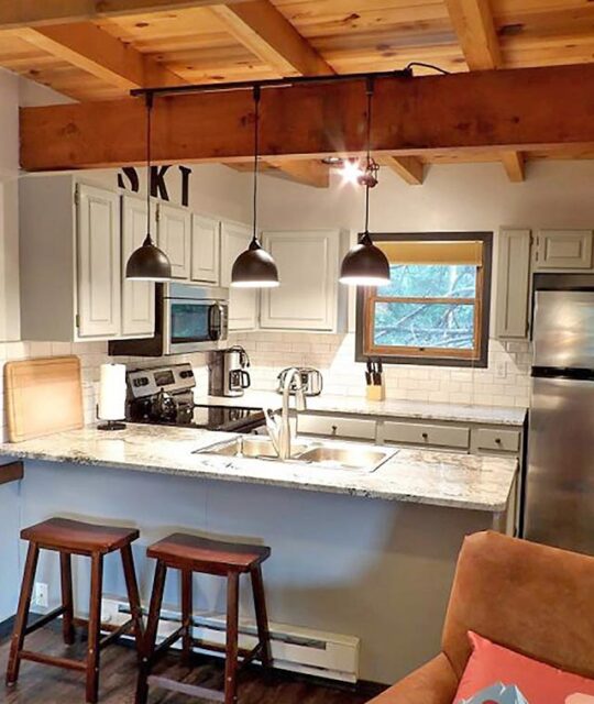 Bright, modern kitchen in mountain ski chalet