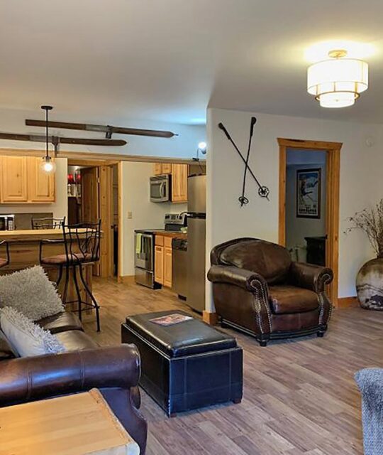 An Abode ski condo with skis as decor in Taos Ski Valley.