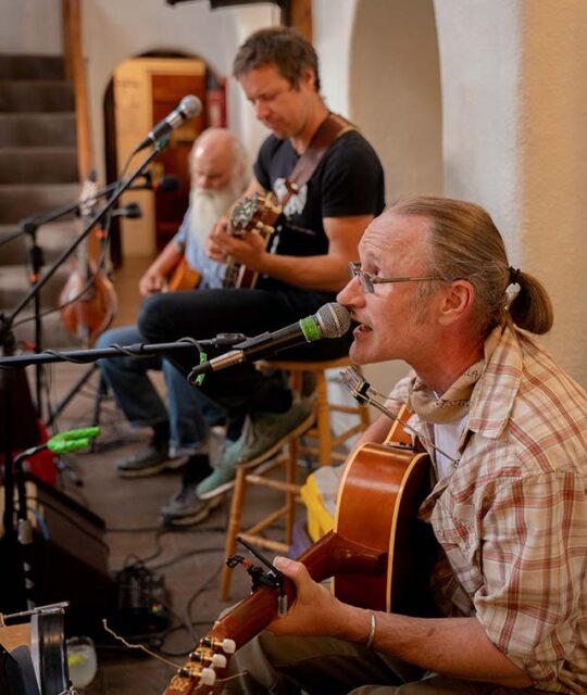 Musicians playing live music at the Adobe Bar in Taos.