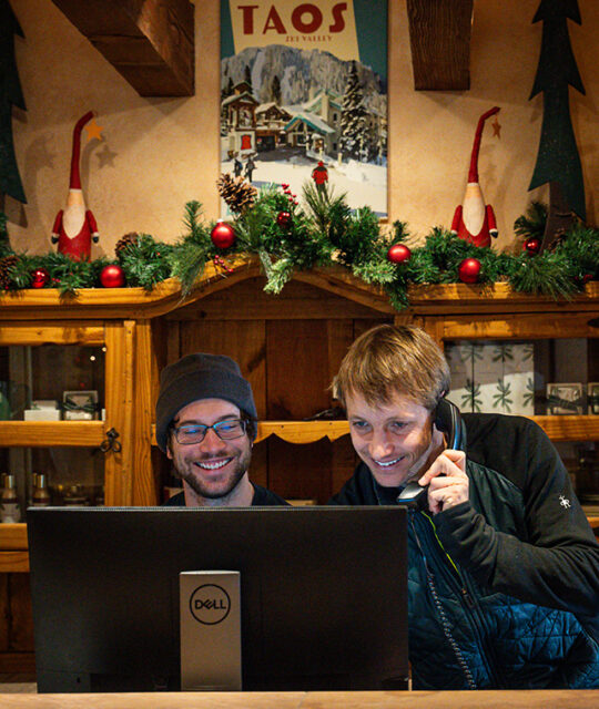 The friendly front desk staff at ski lodge.