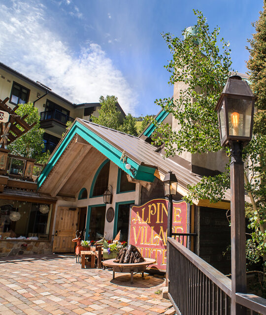 Entrance to Alpine Village Suites in the summer