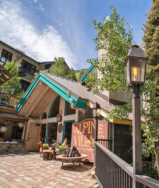 Entrance to Alpine Village Suites in the summer