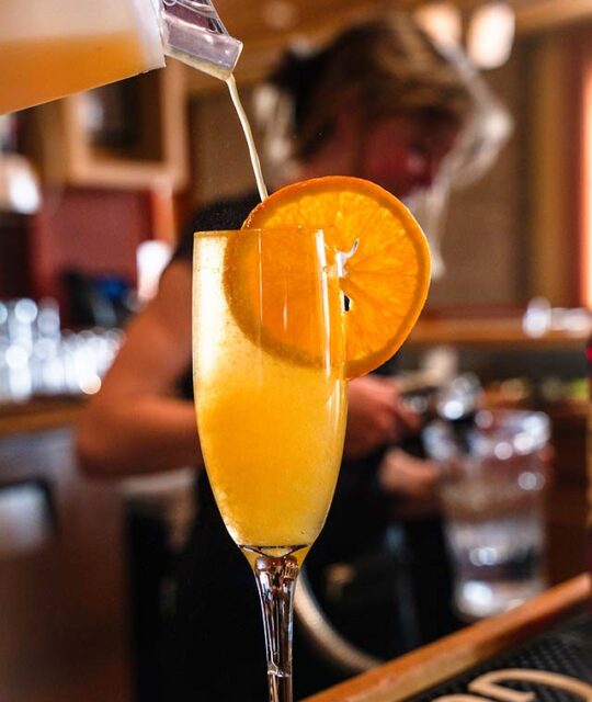Mimosa drink with orange slice