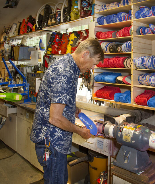 A ski tuner at BootDoctors at work - boot fitting
