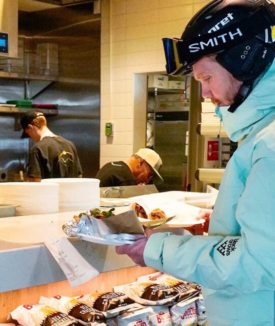 Skier getting lunch at Cid's Kitchen in Taos Ski Valley