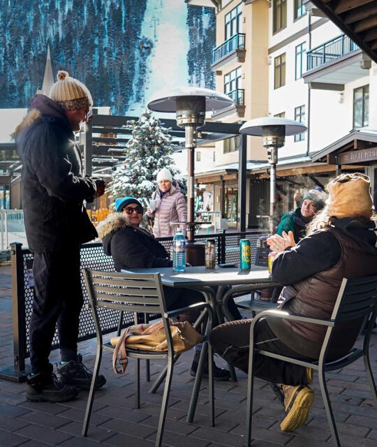 Customers outside in the patio area at Taos Ski Valley