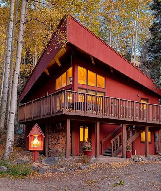 Vacation rental cabin exterior with fall colors