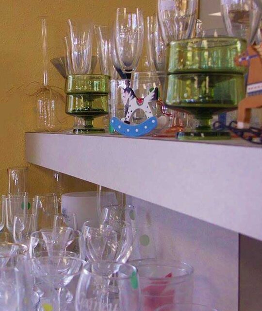 Display of donated glassware at a thrift store.