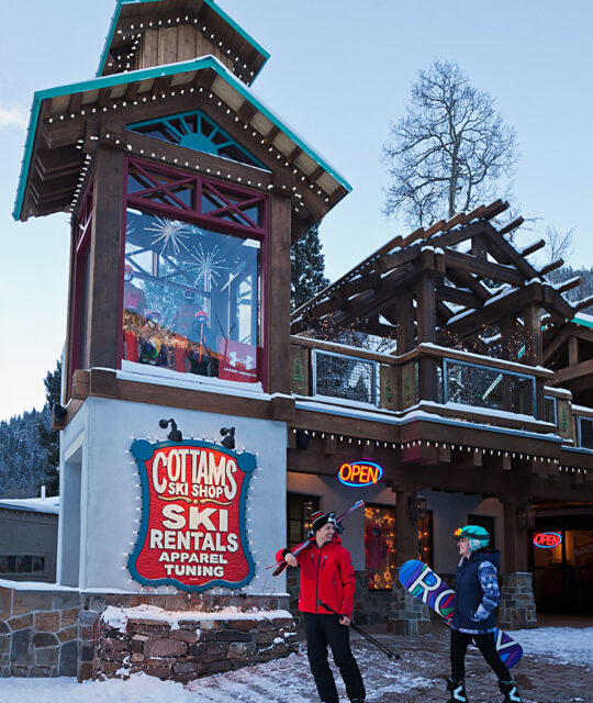 Cottam's Ski Shop entrance with skier and snowboarder