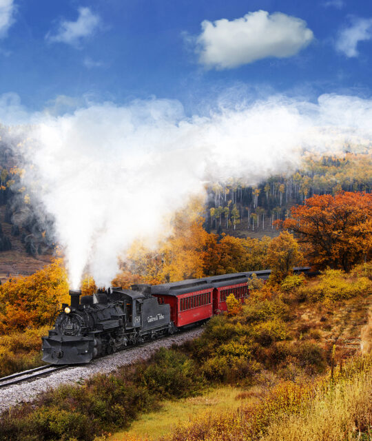 Historic steam train in golden aspens