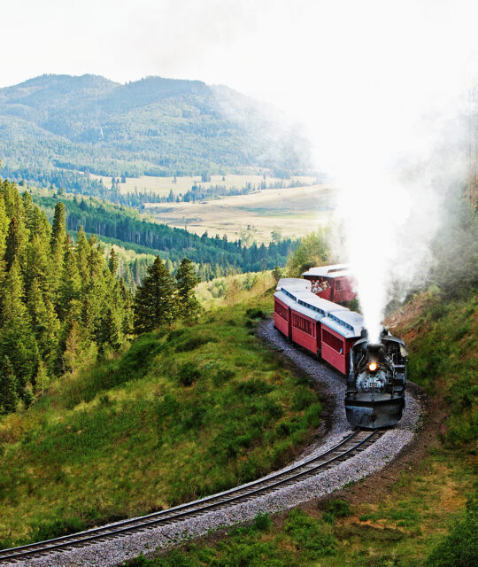 Authentic steam train in mountain scenery