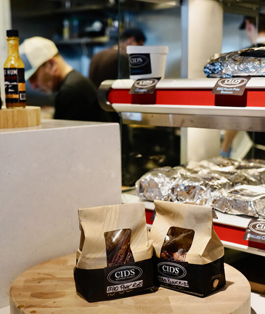 Display of hot prepared BBQ and sandwiches at Cid's Mountain Market.