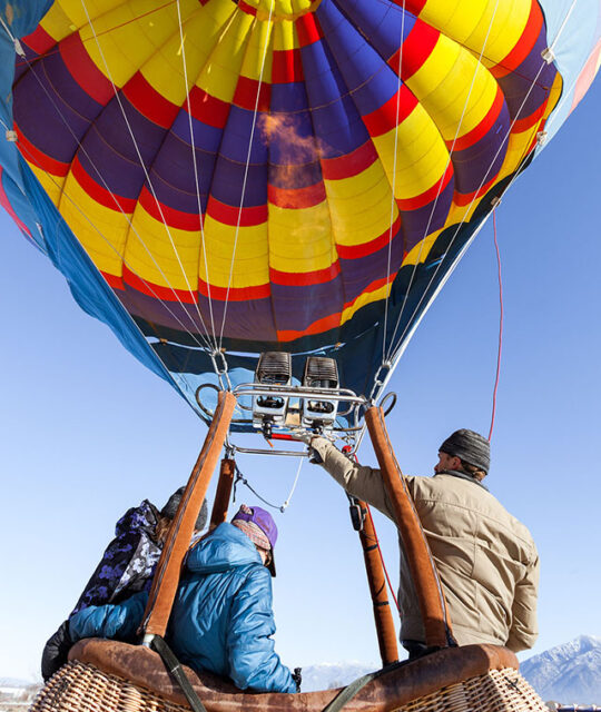 Close up view under the ignited torch and filling the hot air balloon.