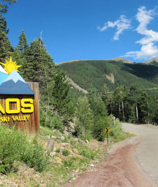 Taos Ski Valley resort welcome sign in summer.