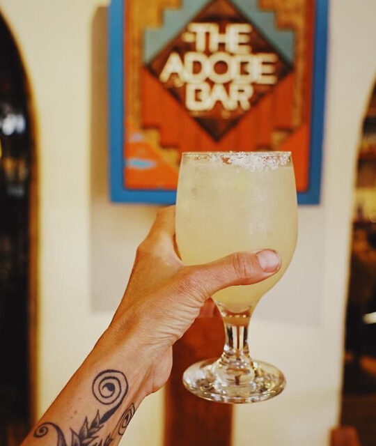 Toasting the Adobe Bar with a margarita.