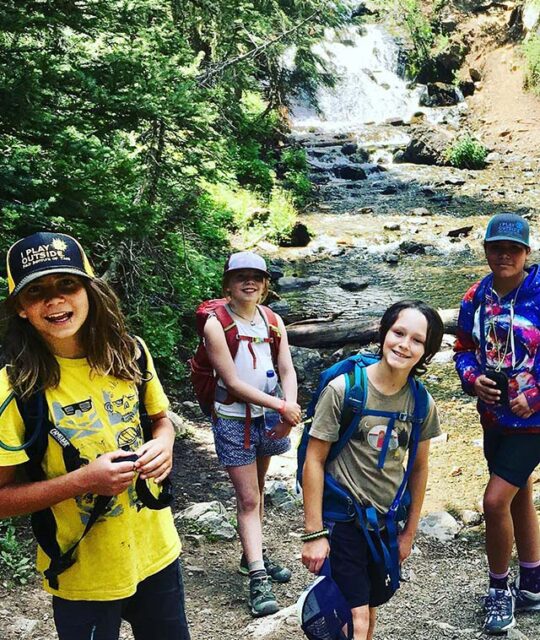 Field Institute of Taos kids campers exploring by a stream