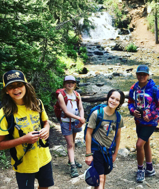 FITaos kids group hike by stream