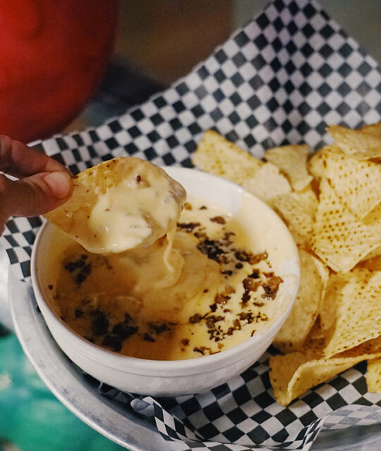 Chips and queso dip at Gutters Bowling Alley