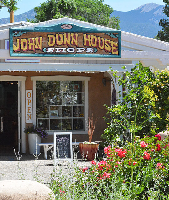 John Dunn Shops sign and flowers