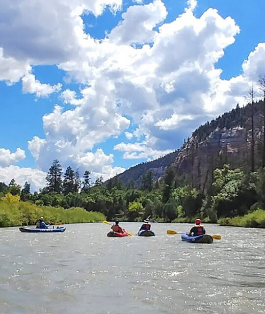 Three rafts on the Rio Chama in New Mexico