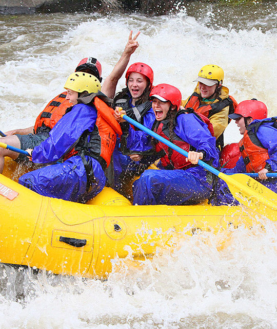 Women whitewater rafting