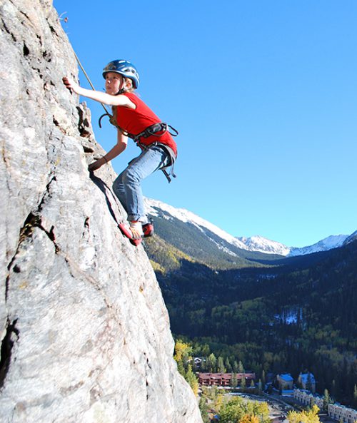 Boy rock climbing in Taos Ski Valley
