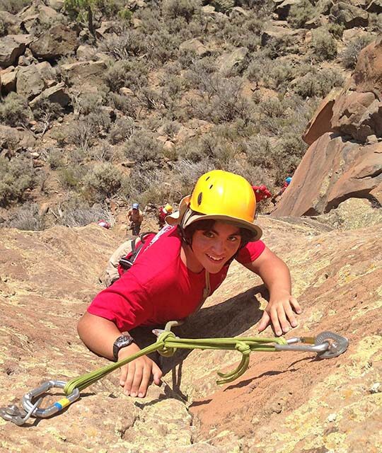 Woman rock climbing in the Rio Grand Gorge near Taos
