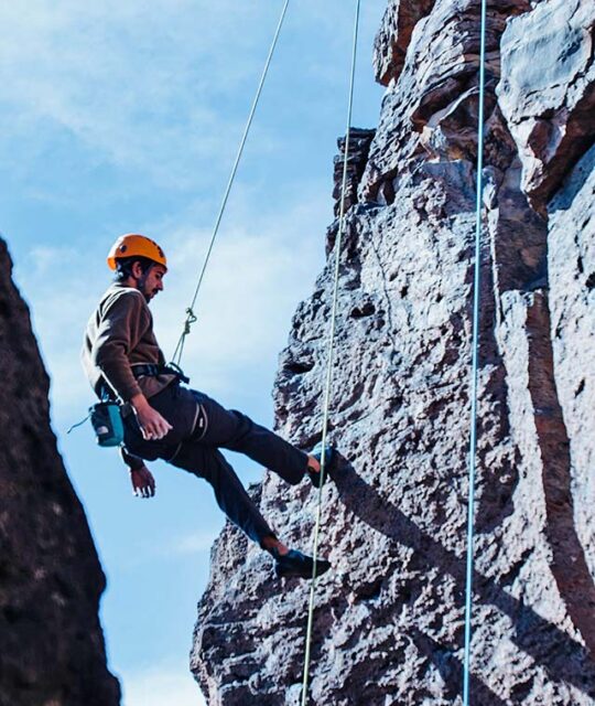 Rock Climber rappelling the Rio Grande Gorge in New Mexico