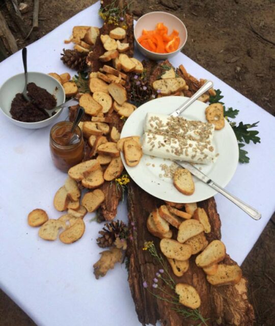 Gourmet food spread on white tablecloth