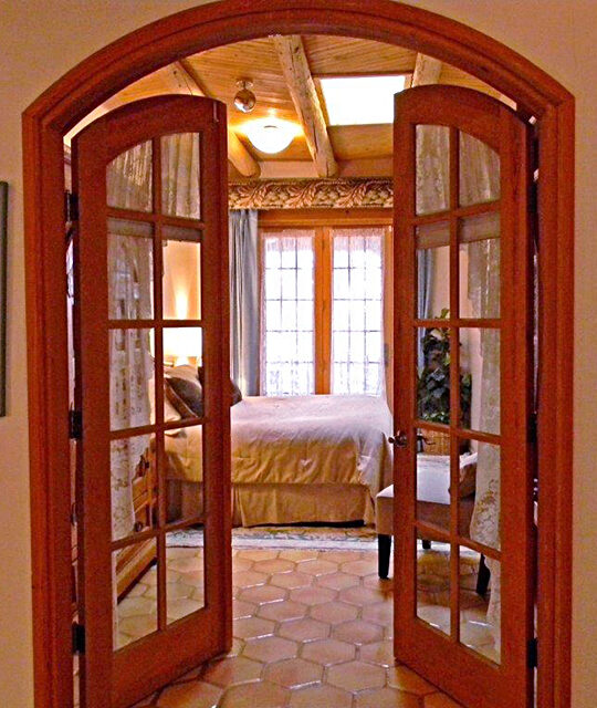 French doors leading into a beautiful bedroom