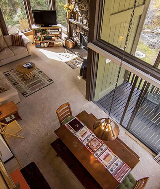 Living area and dining table at a condo