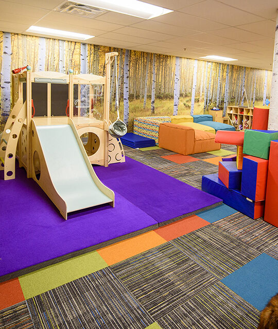 Play area and slide inside the Rio Hondo Learning Center in Taos