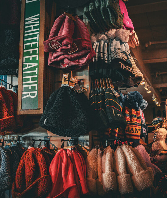 Ski shop winter knit hats display.