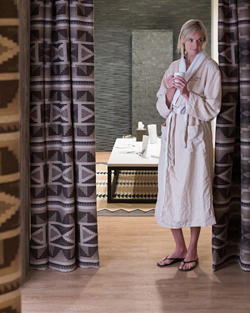 Woman in robe at a spa