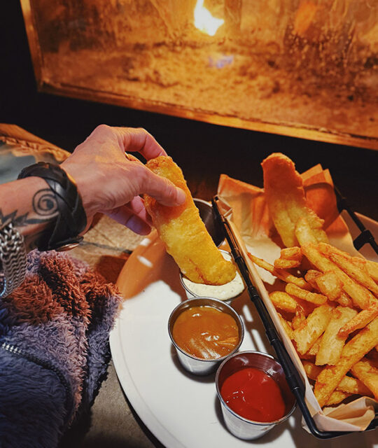 Fish and chips by the fireplace at Blonde Bear Tavern in Taos Ski Valley.