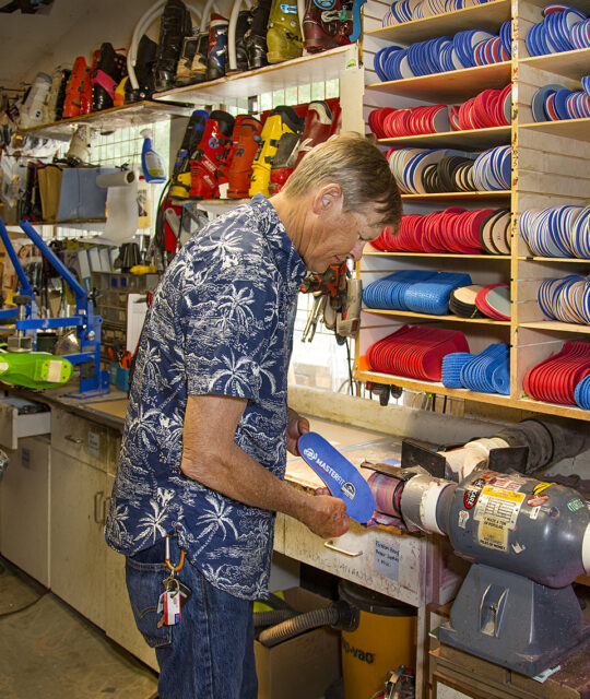 A ski tuner at Bootdoctors at work - boot fitting