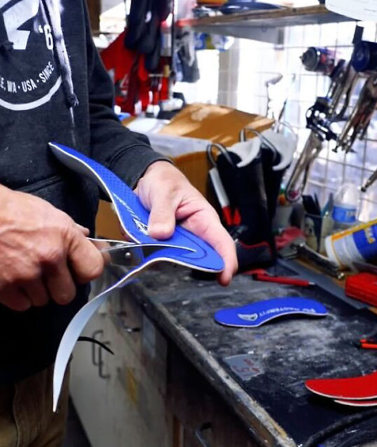 Trimming footbeds at Bootdoctors.