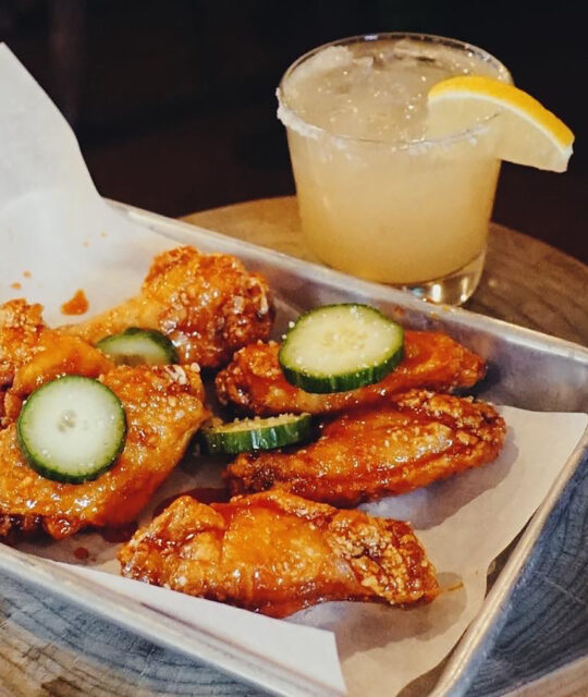 Hot wings and a lemon cocktail