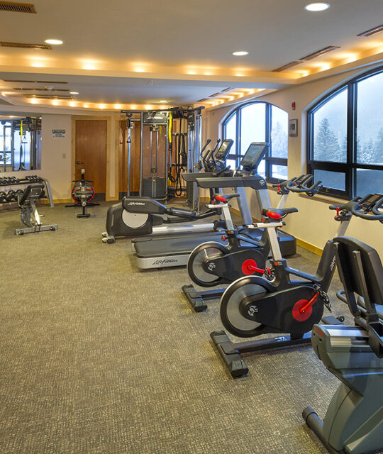 Fitness machines and weights in a gym.