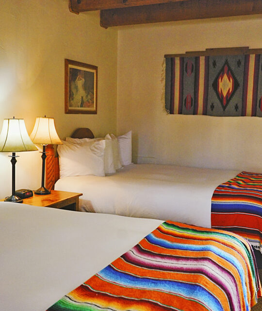 Colorful southwest bedding in cozy double bed hotel room