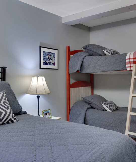 Condo bedroom with bunk beds.