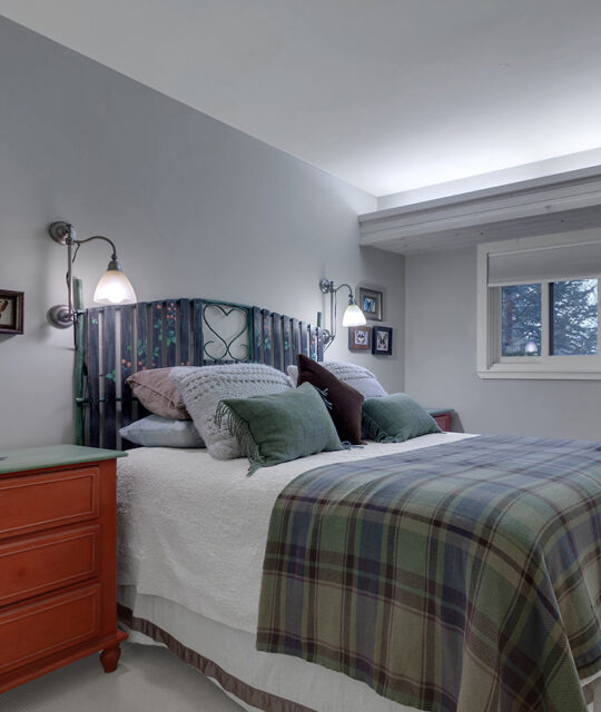 Condo bedroom in grey tones.
