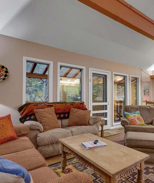 Open living and dining of a ski condo.